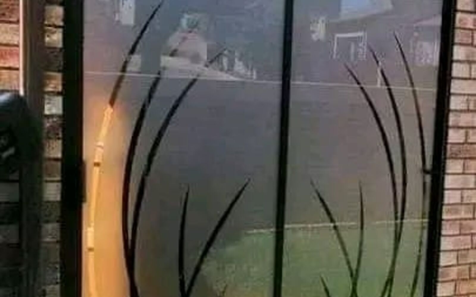 Sliding glass door with a decorative frosted reed pattern