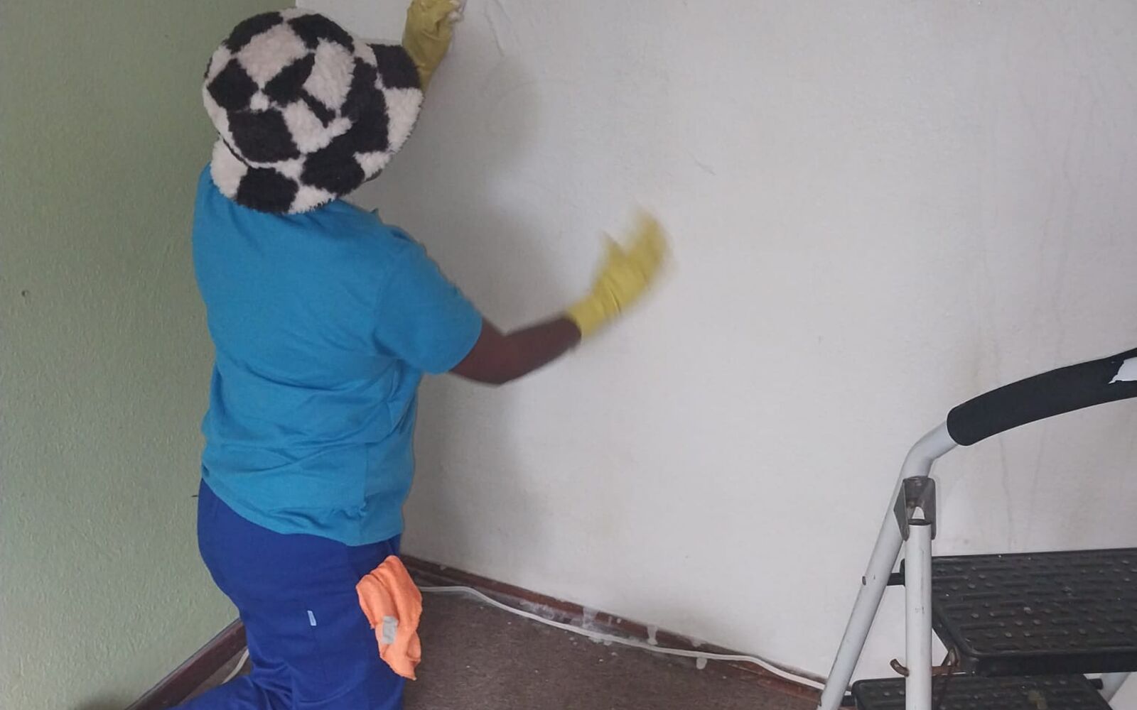 Team member steam cleaning a mattress