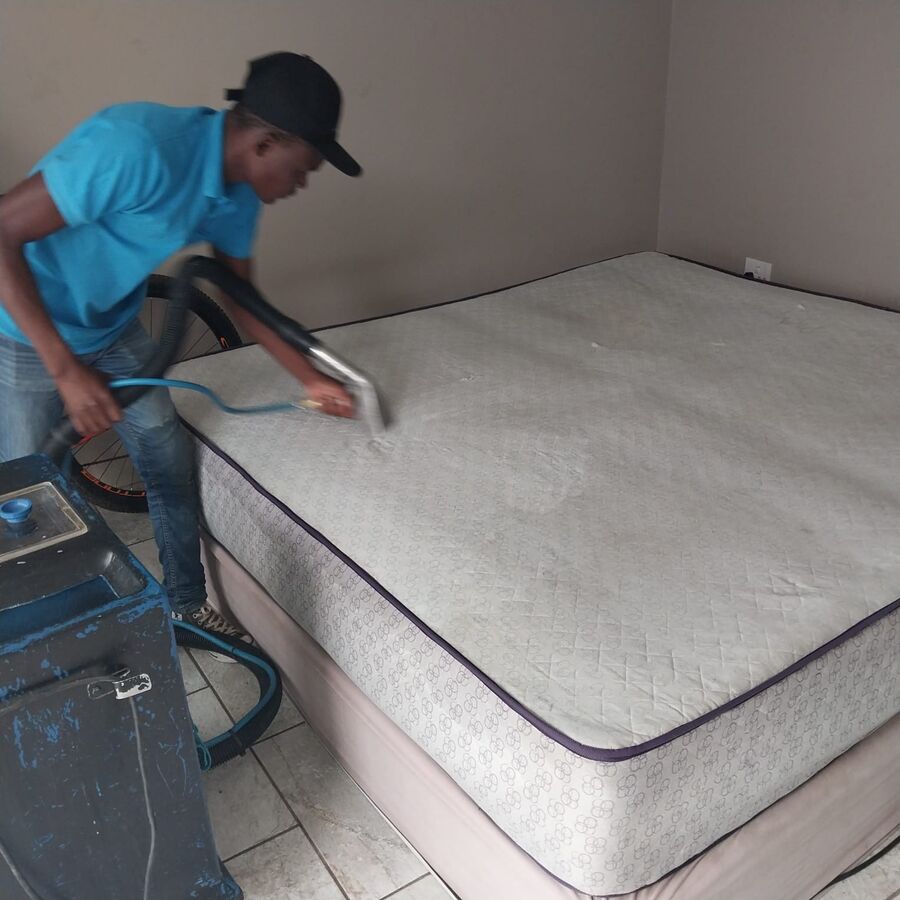 Mattress being steam cleaned